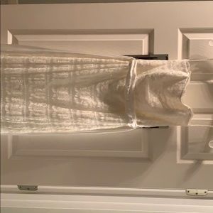 Brand new wedding dress never worn, color is ivory